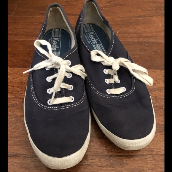 navy blue and white keds